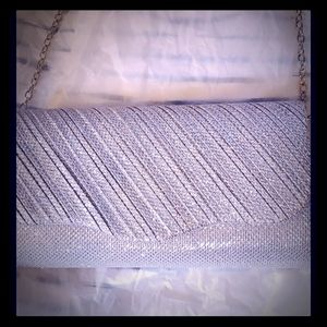 An attractive dressy small purse, silver ,